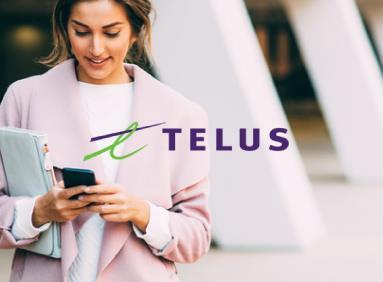 Professional woman texting on her smartphone with Telus logo