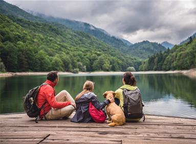 Family visiting a tourism destination in the mountains and lakes