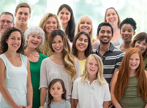 Group of ethnic and age-diverse people smiling.