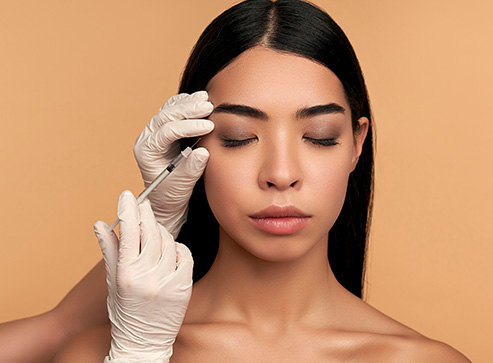 Young woman receiving a cosmetic injection