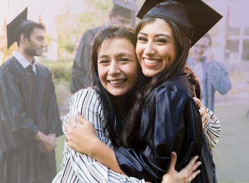 A female graduate embracing mother