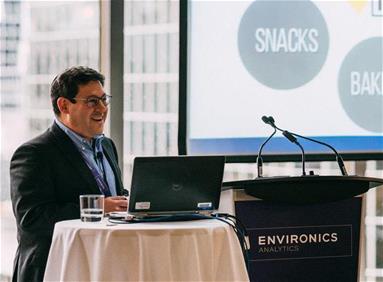 Environics Analytics associate talking at a conference 