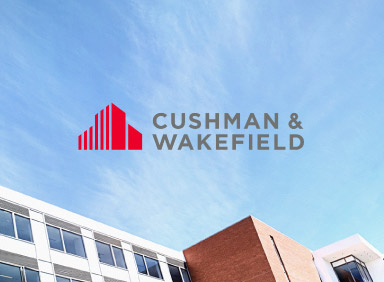 View of the top of buildings with Young girl pretending to be a superhero with Cushman and Wakefield logo in the centre of image