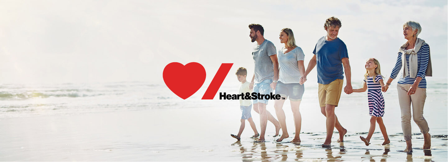 Image of family walking on beach with Heart and Stroke Logo in centre of image