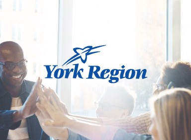 People smiling and giving high fives, with the York Region logo, for a case study