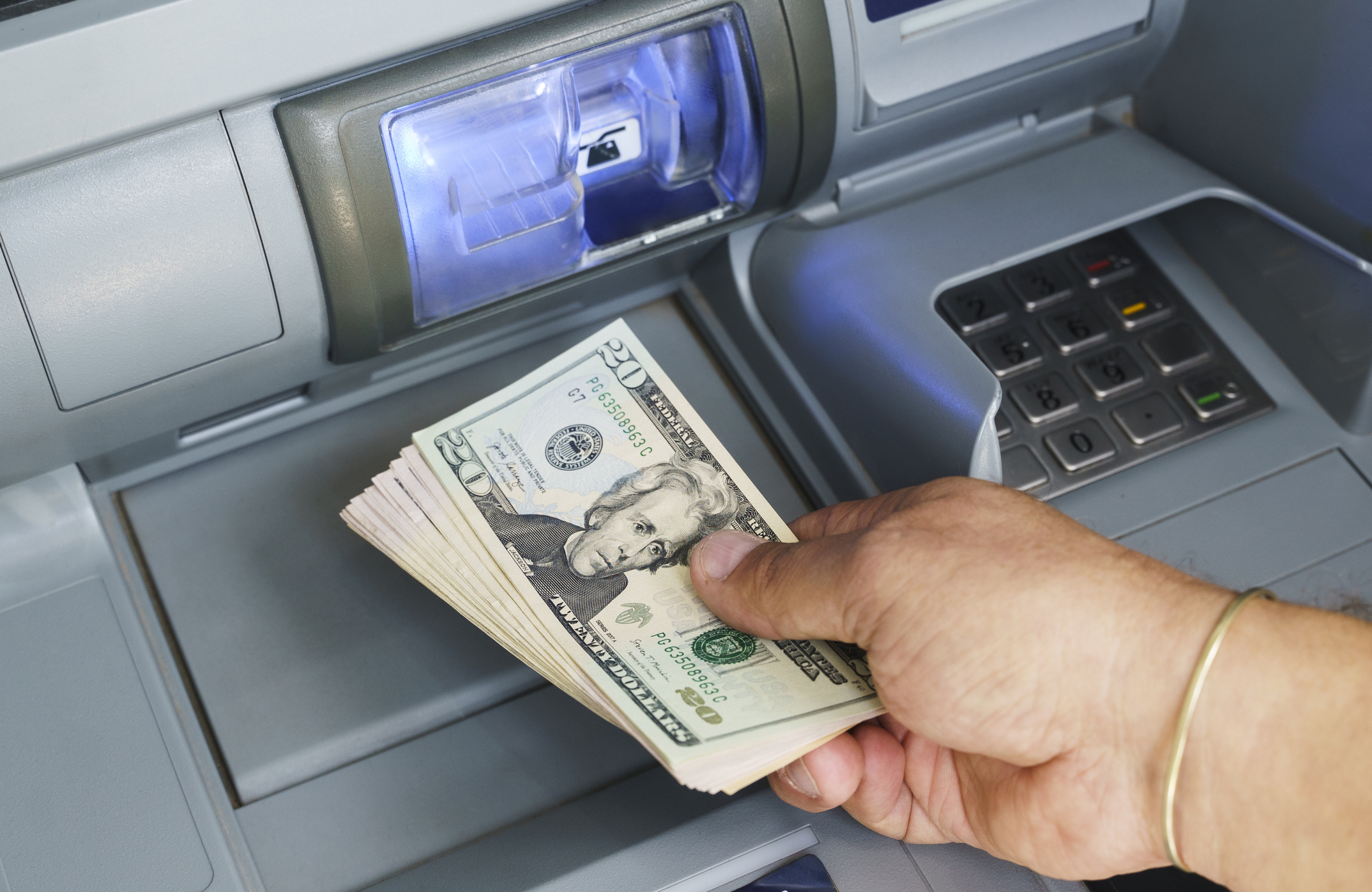 Holding American Bill Cash at Atm machine